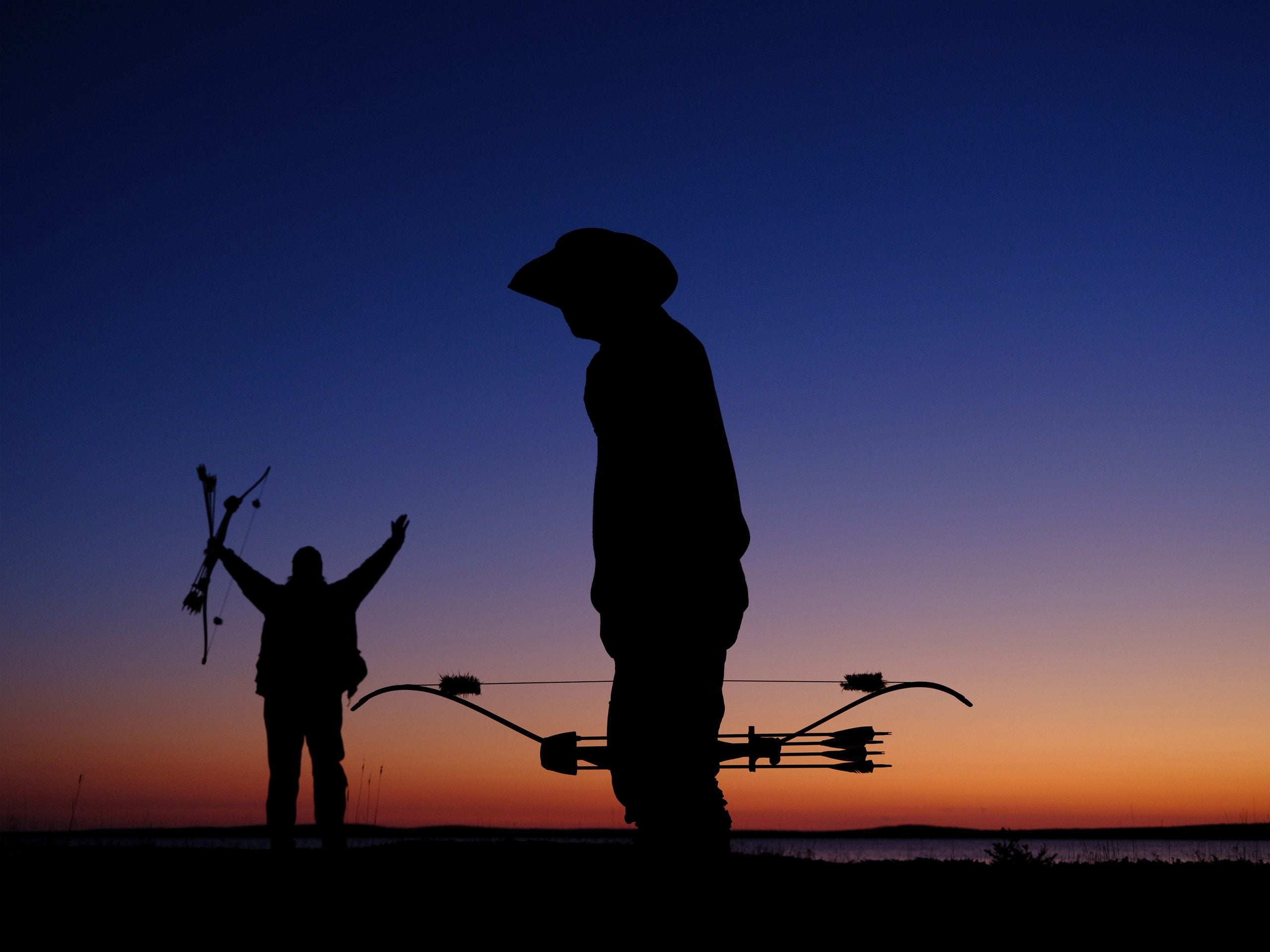 'Alone' Season 10 cast members silhouetted against night sky