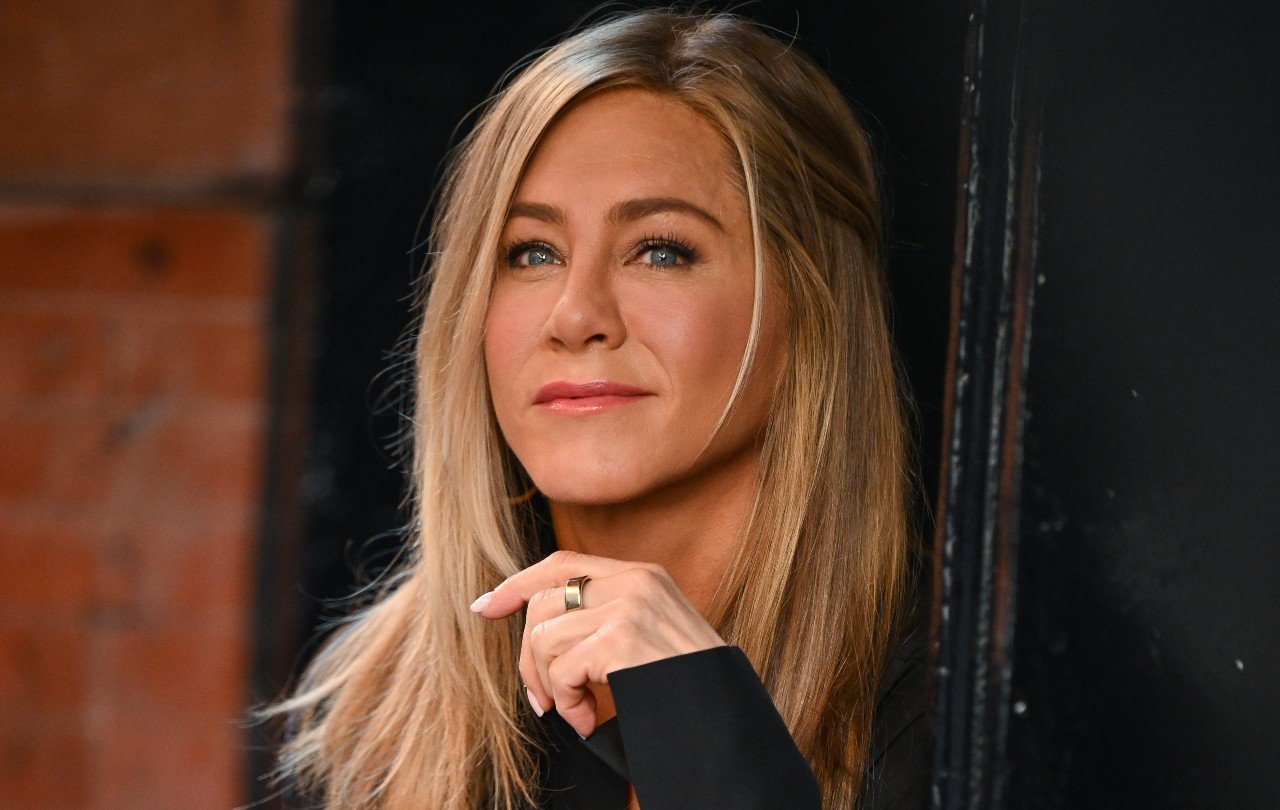 Jennifer Aniston smiles during a media event.