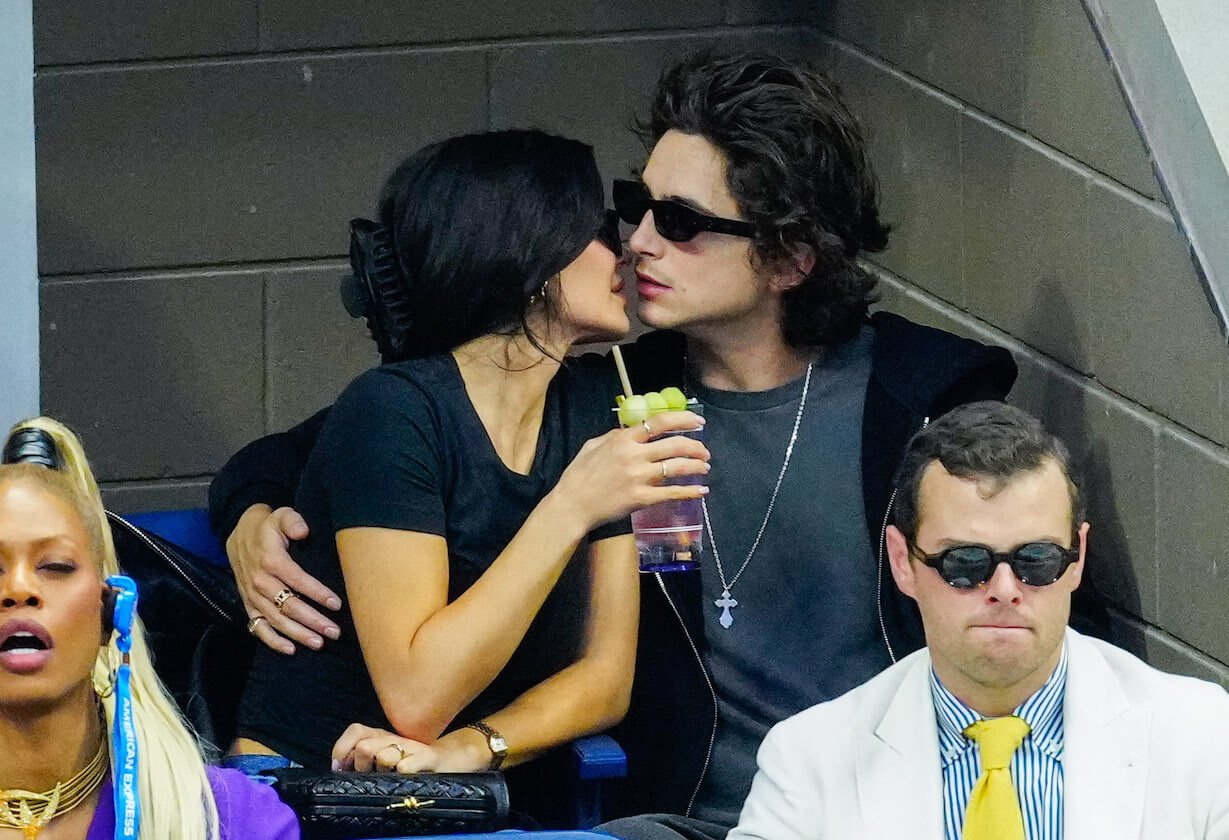 Kylie Jenner from 'The Kardashians' Season 4 kissing Timothée Chalamet while sitting at the 2023 US Open Tennis Championships