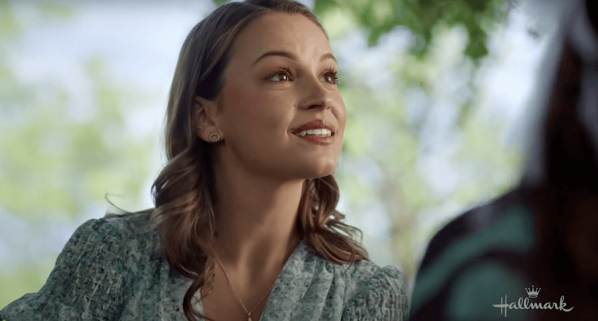 Kayla Wallace smiling in the Hallmark movie 'Feeling Butterflies'