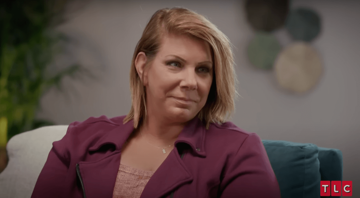 Smiling Meri Brown of 'Sister Wives' in a purple top