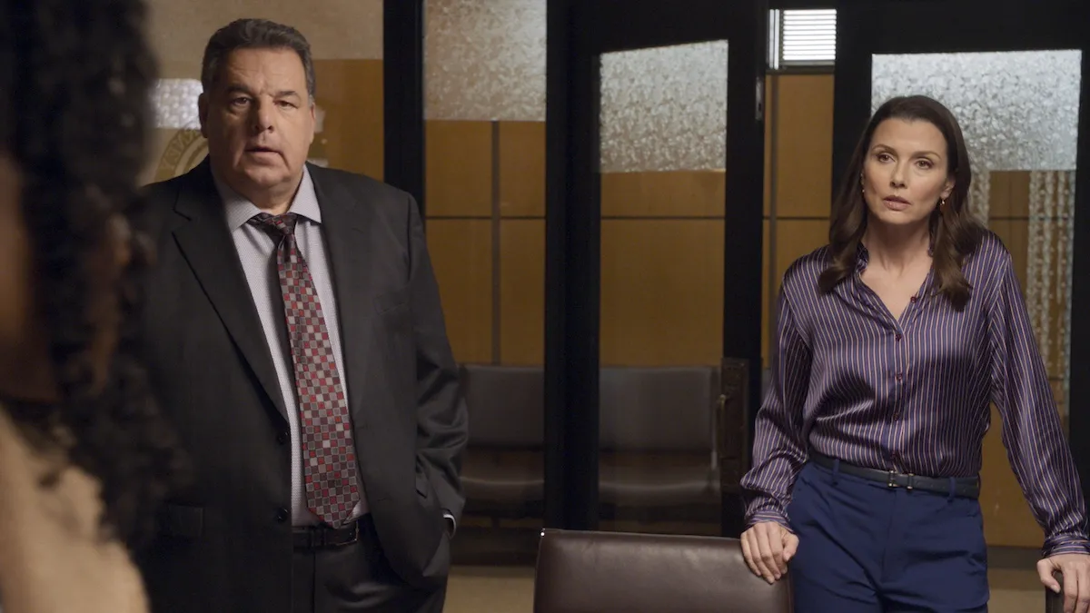 Anthony and Erin standing next to each other in an office in an episode of 'Blue Bloods'