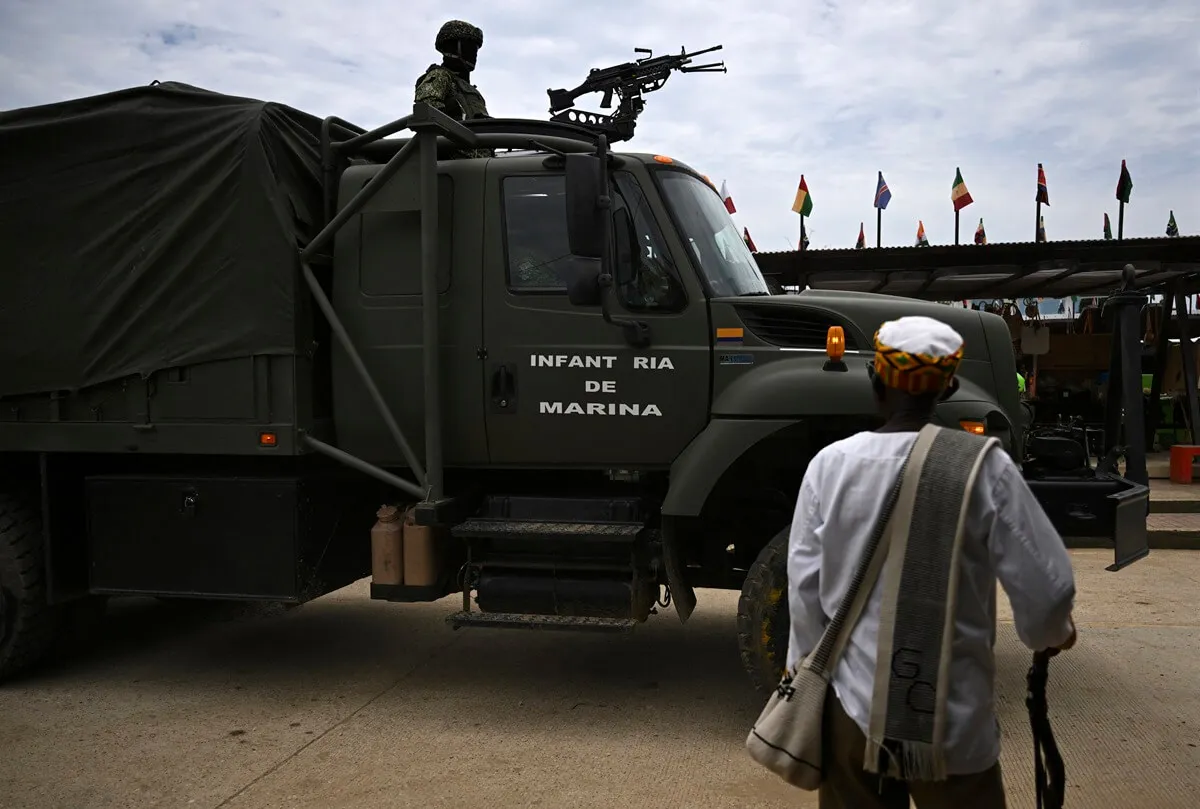 Colombian marines patrol during security operations for the arrival of Prince Harry and Meghan Markle in San Basilio de Palenque, Bolivar department, Colombia