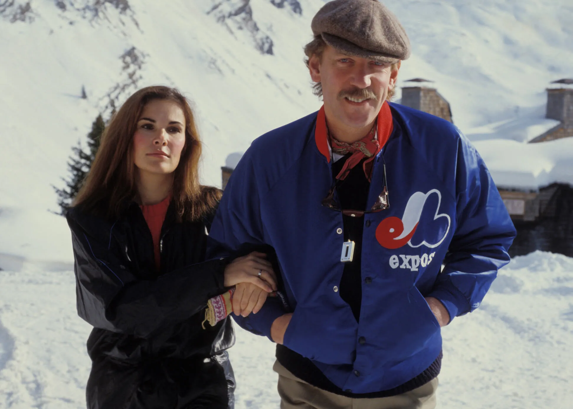 Donald Sutherland linking arms with his wife, Francine Racette, in 1982