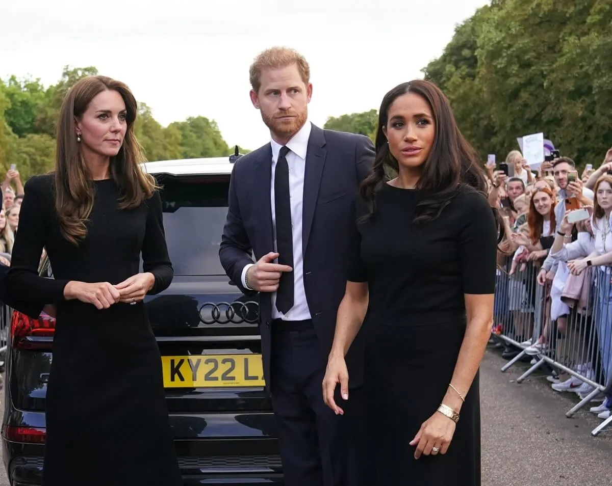 Kate Middleton, Prince Harry, and Meghan Markle meet members of the public on the long Walk at Windsor Castle