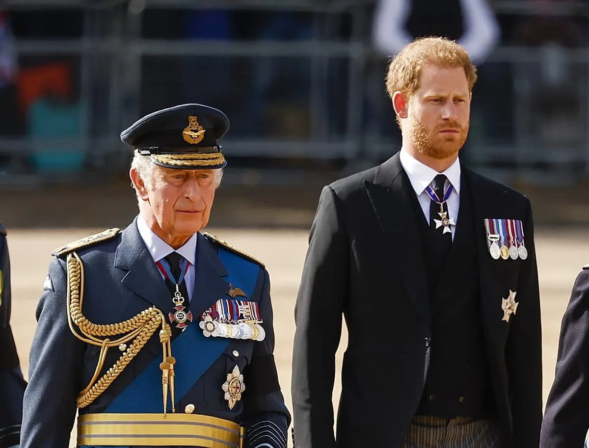 King Charles III and Prince Harry walk behind the coffin during the procession for the Lying-in State of Queen Elizabeth II