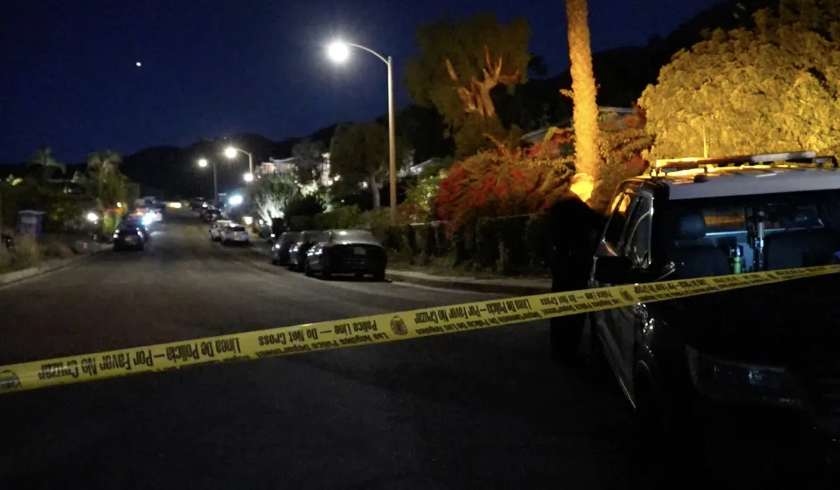 Police tape blocks the street leading to Matthew Perry's home on he night of his death.