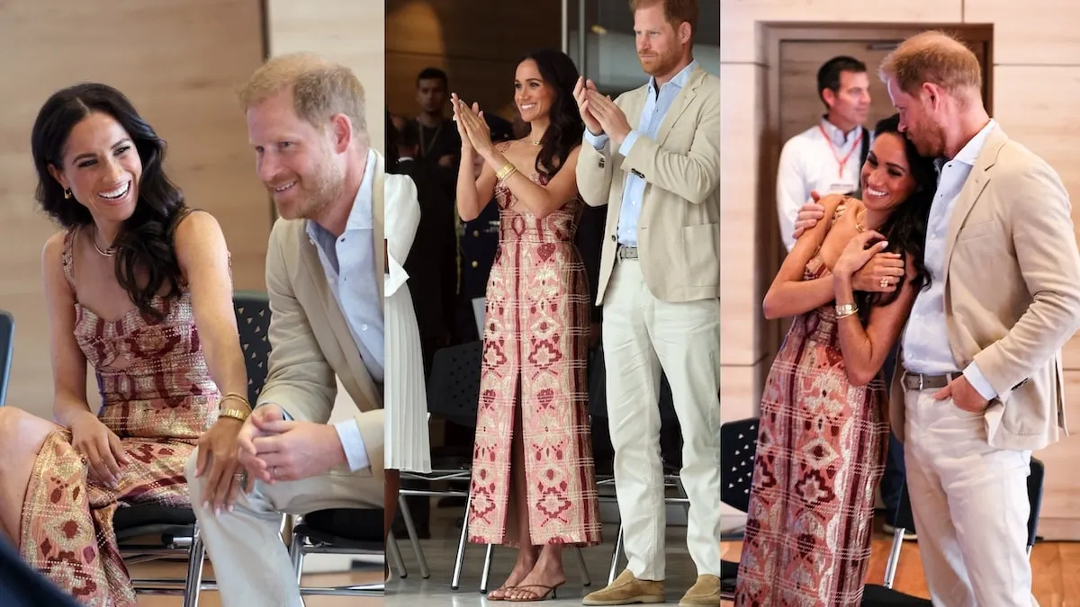 Wearing a red and pink dress, Meghan Markle claps for performers in Columbia