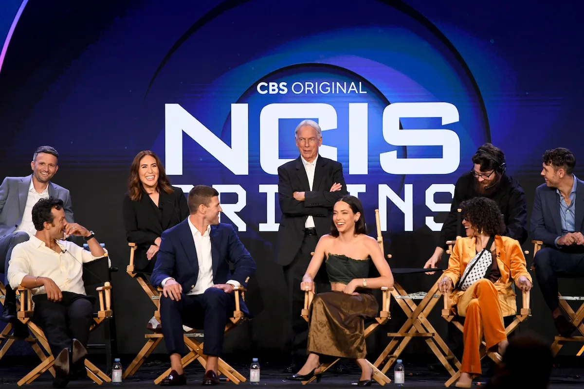 'NCIS: Origins' cast sitting on stage at a TCA Summer 2024 press tour